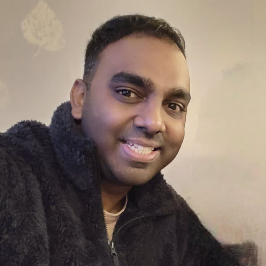 Ash smiling at home in a fleece